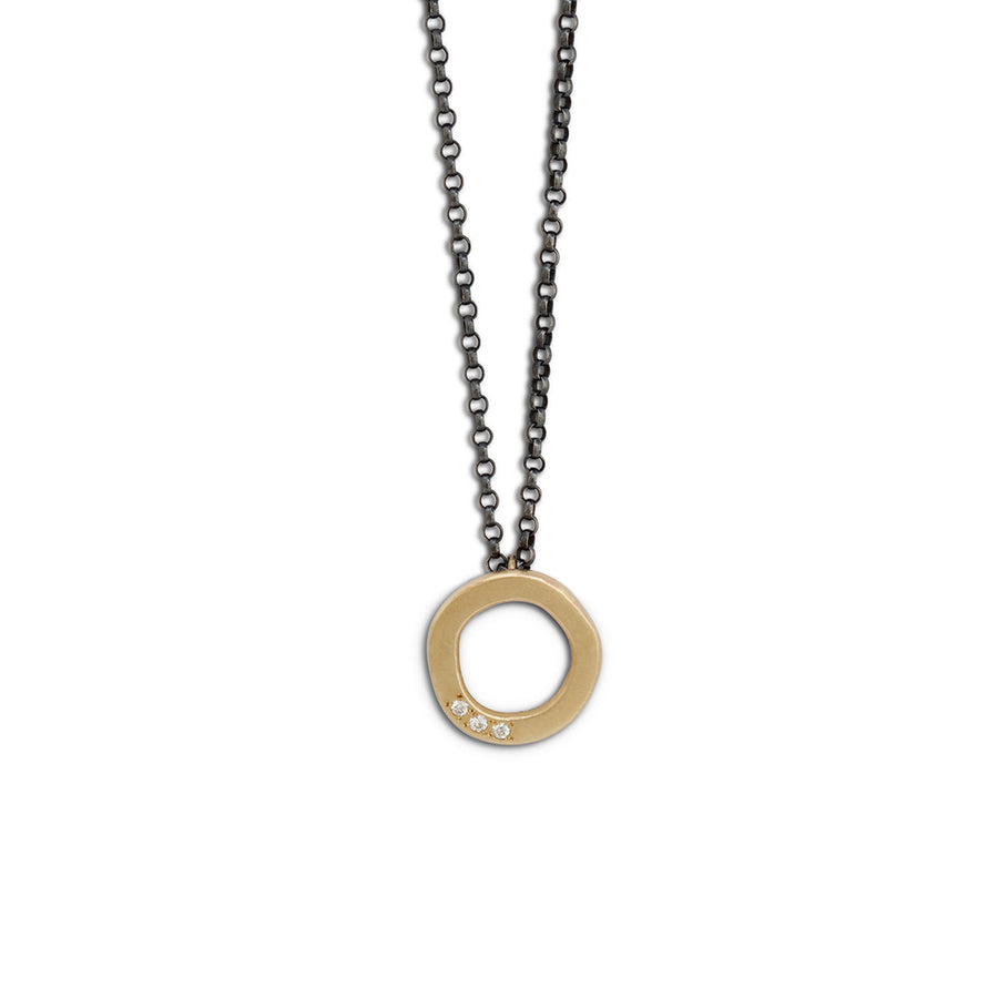 Gold studded halo pendant on oxidised silver chain