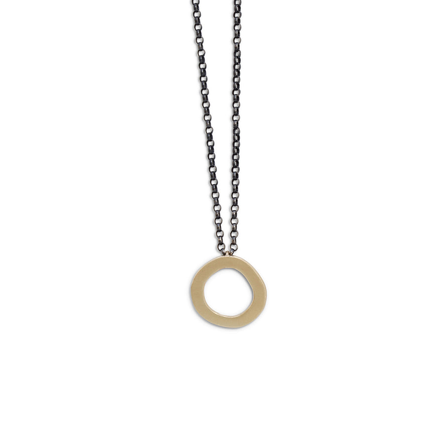 Gold halo pendant on oxidised silver chain