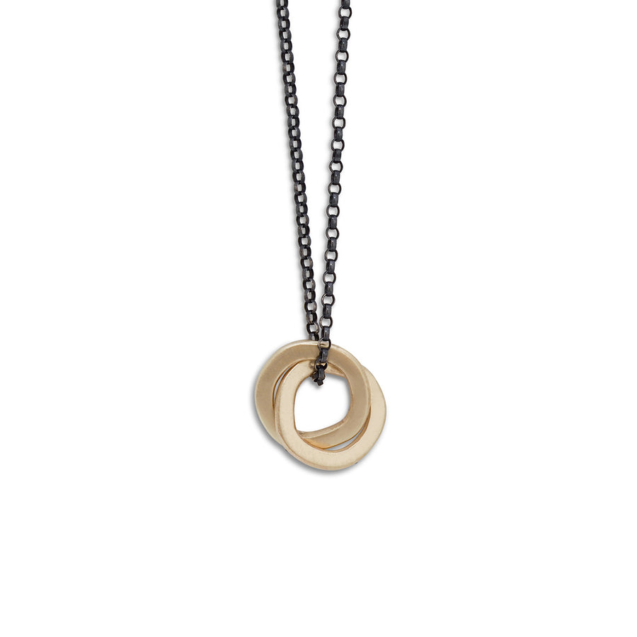 Gold double halo pendant on oxidised silver chain