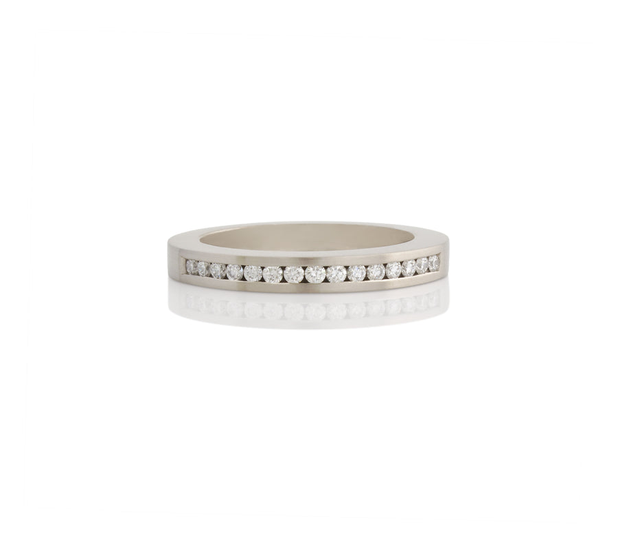 channel set diamonds in white gold ring