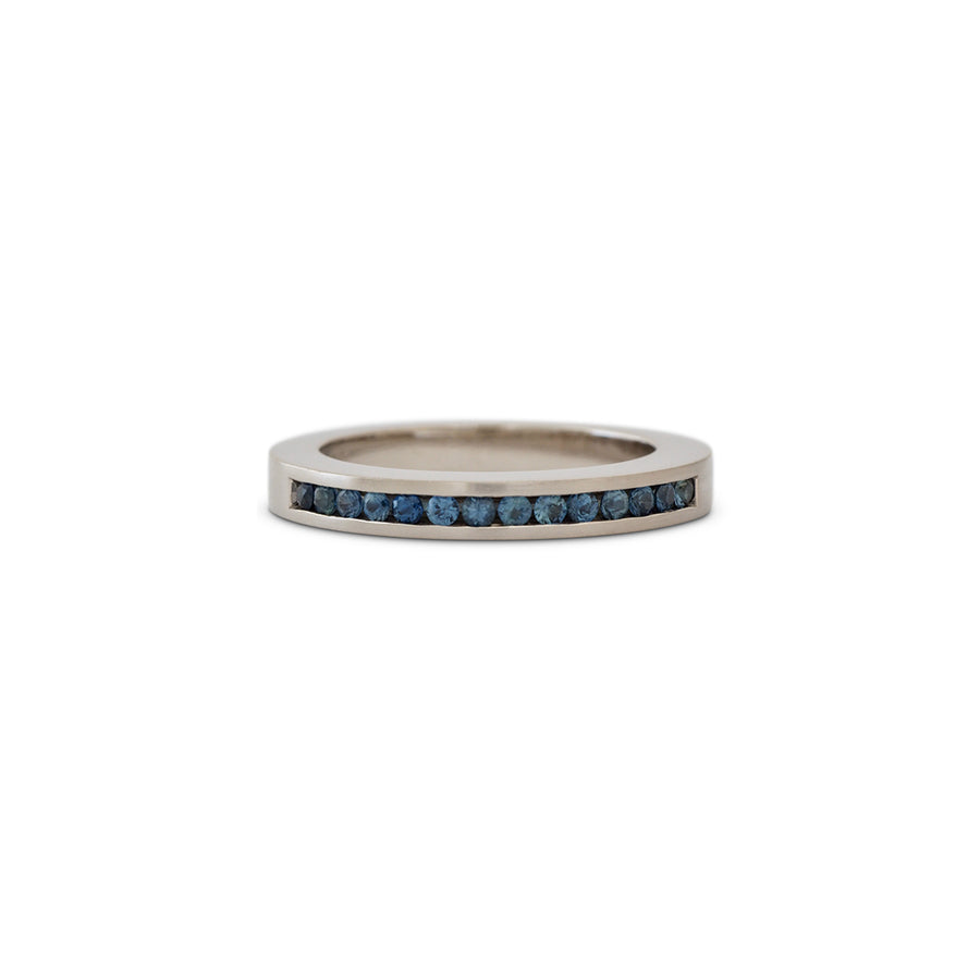 White gold ring channel set blue sapphires