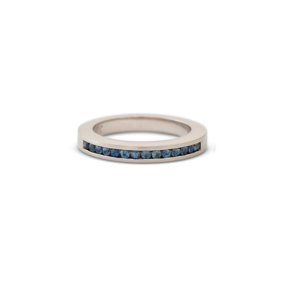 White gold ring channel set blue sapphires