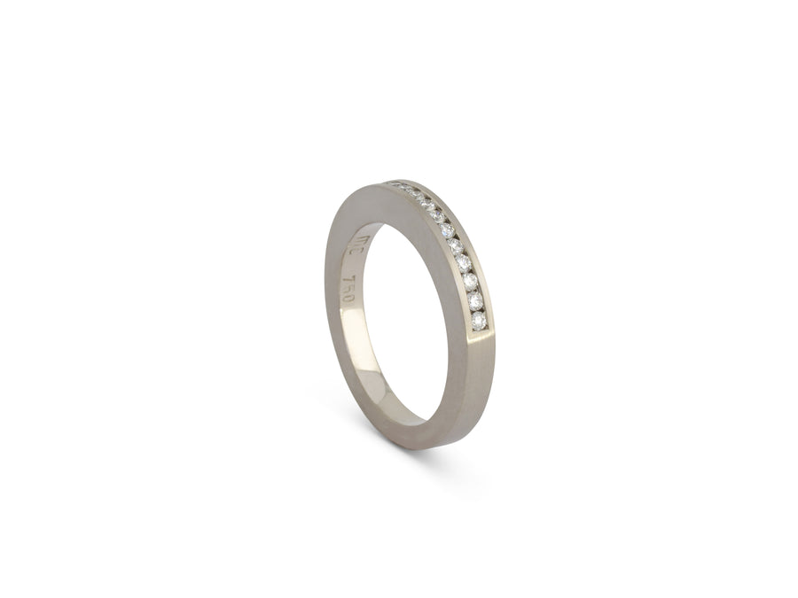 channel set diamonds in white gold ring