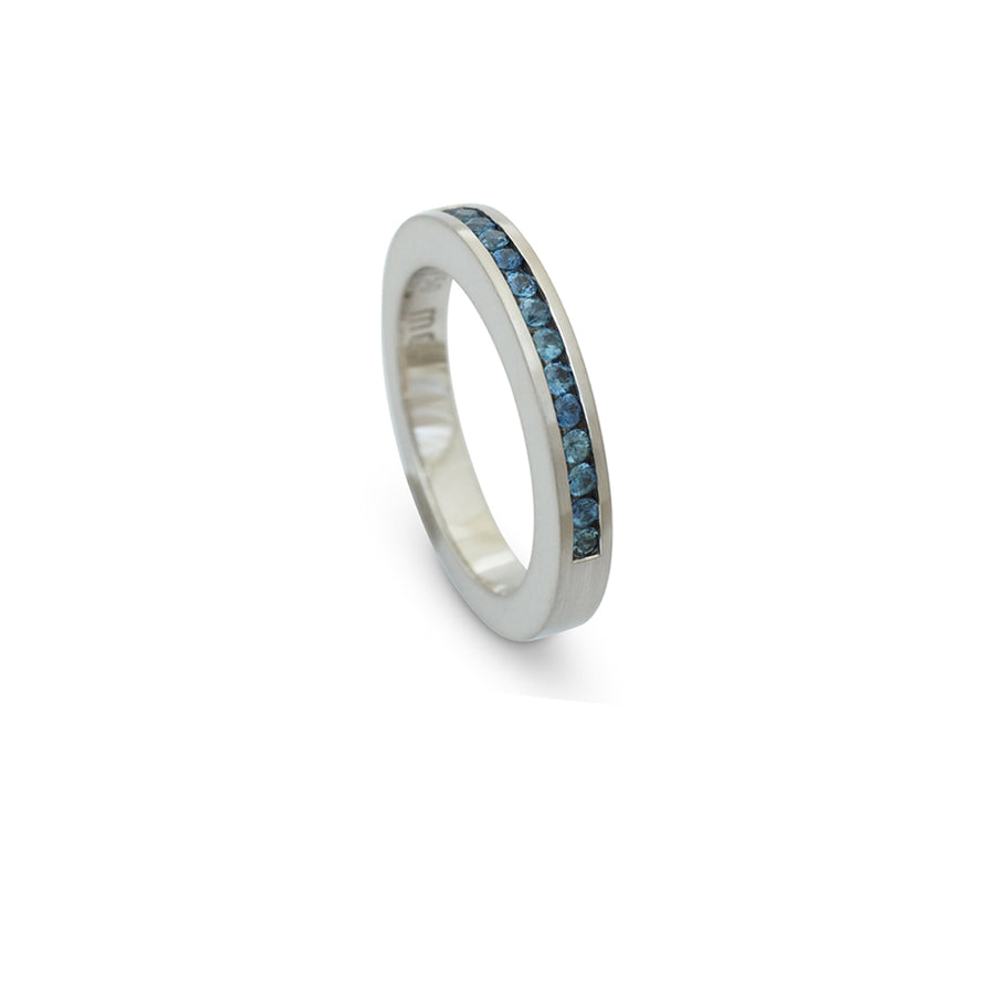 White gold ring channel set blue sapphires