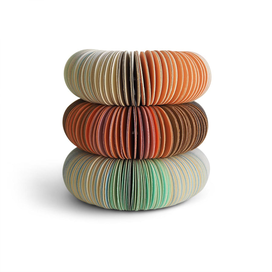 paper bangle stack.  Peach, brown, mint.