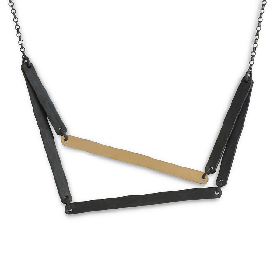 Oxidised silver lining necklace with one gold detail.
